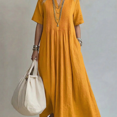 Yellow pleated maxi dress with short sleeves and round neckline