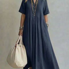 Navy pleated maxi dress with short sleeves and round neckline