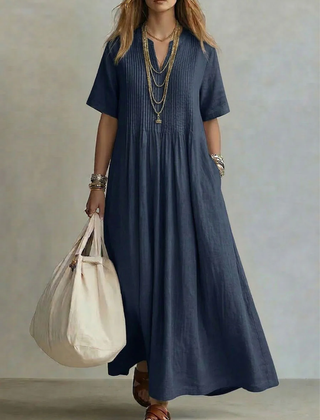 Navy pleated maxi dress with short sleeves and round neckline