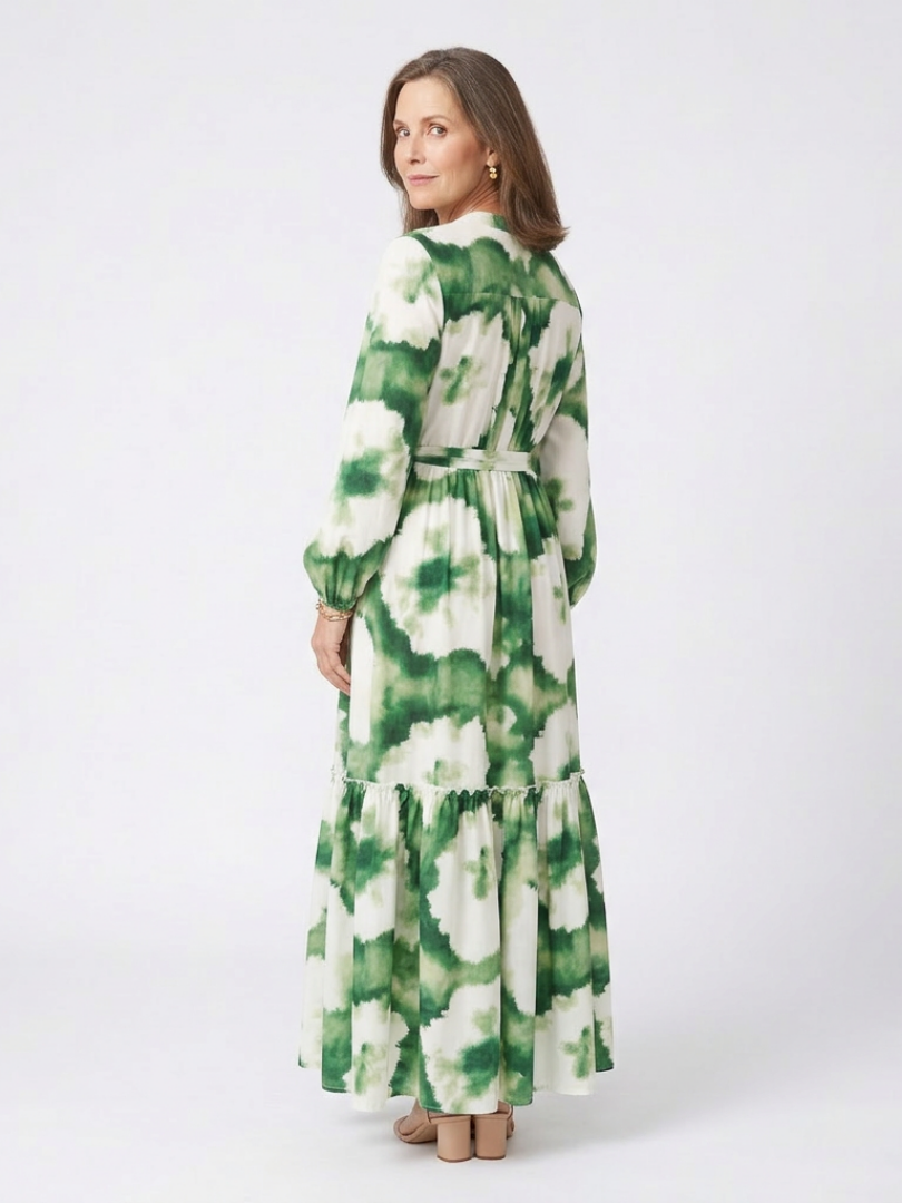 Long sleeve tiered maxi dress with green and white tie-waist detail, side view