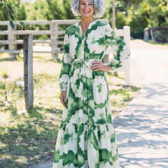 Long sleeve tiered maxi dress with green and white floral print and tie belt detail