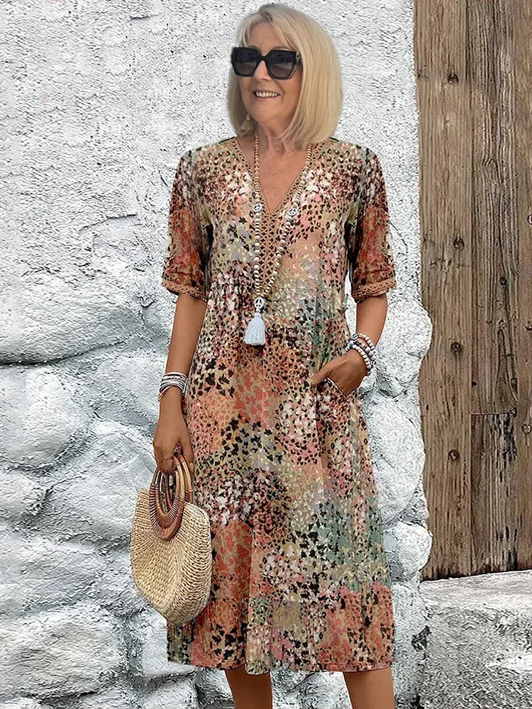 Floral midi dress with V-neck button front, short sleeves and tassel trim (beige/pink)