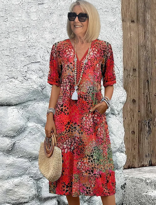 Floral midi dress with V-neck button front, short sleeves and tassel trim (red)