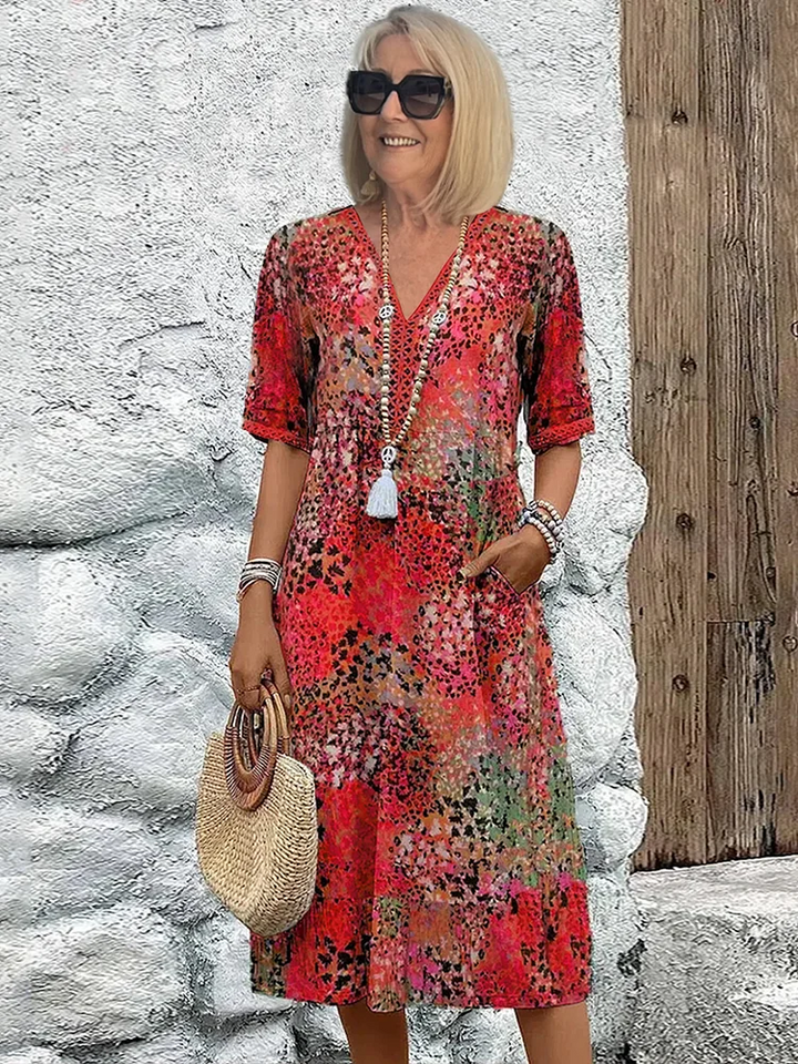 Floral midi dress with V-neck button front, short sleeves and tassel trim (red)