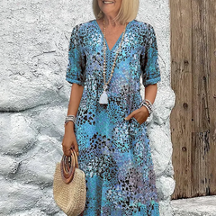 Floral midi dress with V-neck button front, short sleeves and tassel trim (blue)