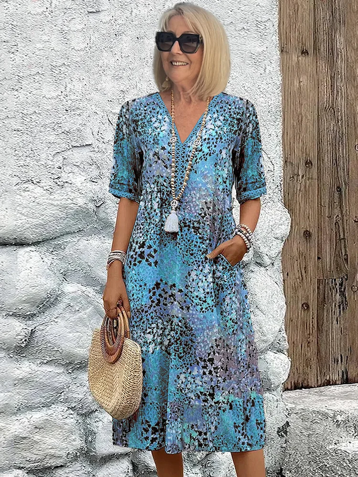 Floral midi dress with V-neck button front, short sleeves and tassel trim (blue)