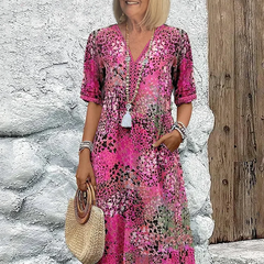 Floral midi dress with V-neck button front, short sleeves and tassel trim (pink)