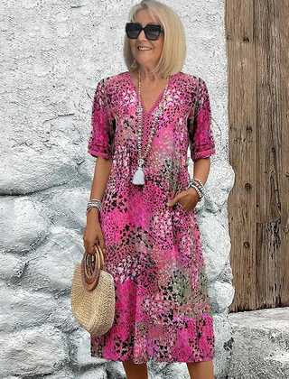 Floral midi dress with V-neck button front, short sleeves and tassel trim (pink)