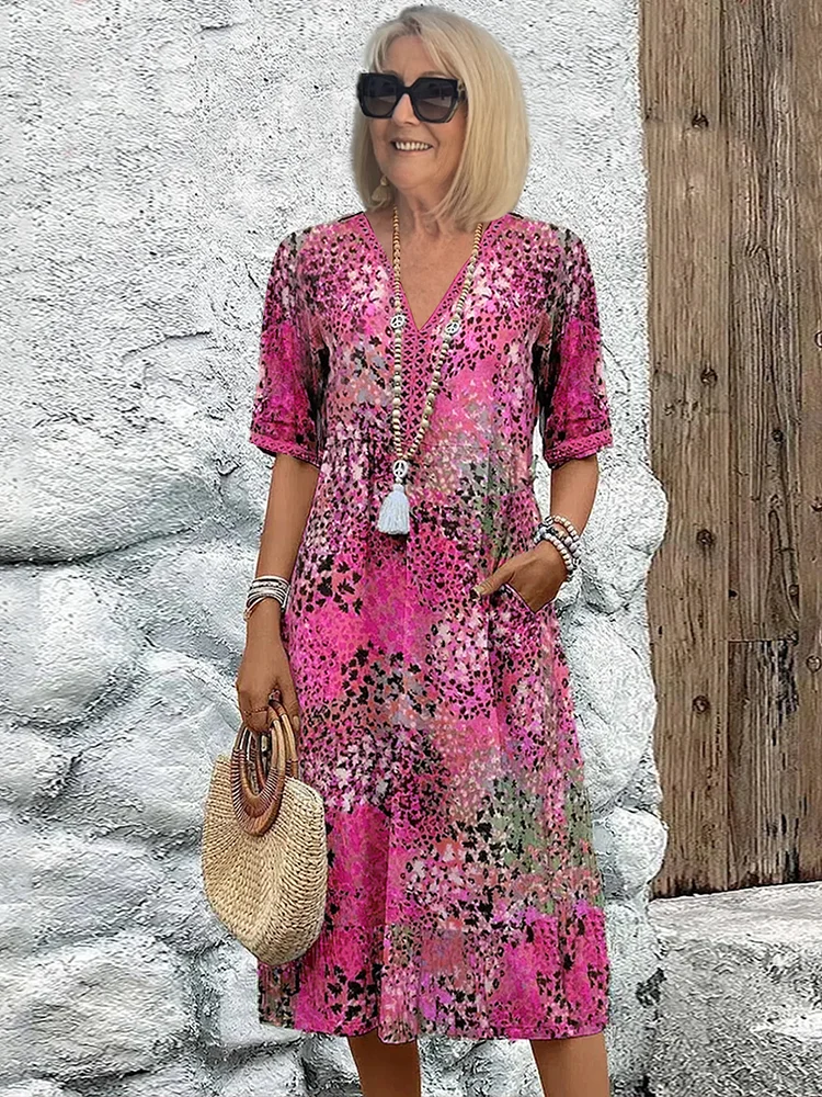 Floral midi dress with V-neck button front, short sleeves and tassel trim (pink)