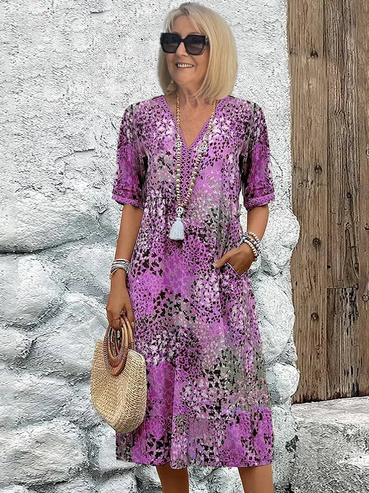 Floral midi dress with V-neck button front, short sleeves and tassel trim (purple)