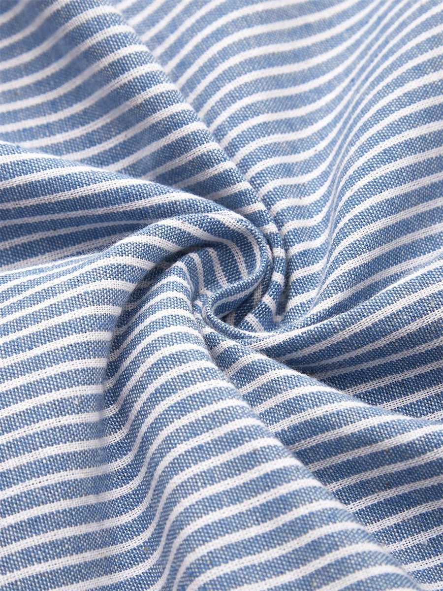 Blue-and-white striped fabric closeup with soft drape texture