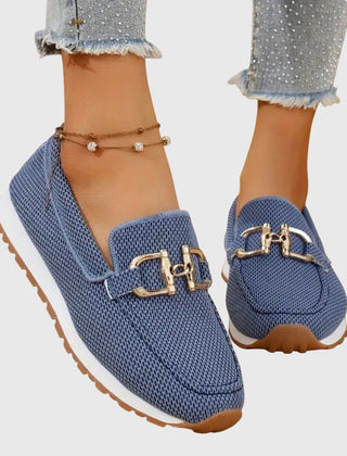 Blue orthopedic loafer sneakers with gold buckle ornament and rubber tread sole