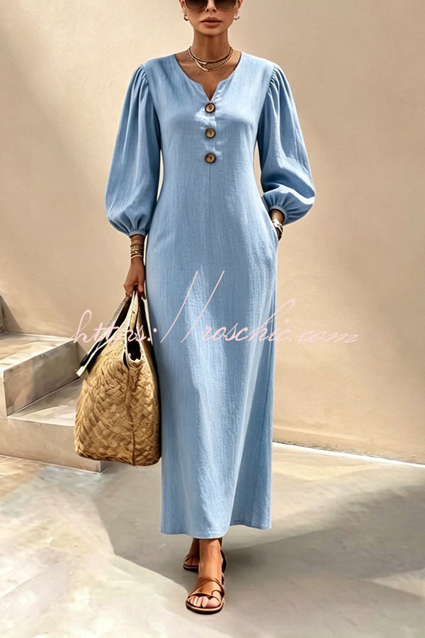 Blue v-neck maxi dress with button front and lantern sleeves