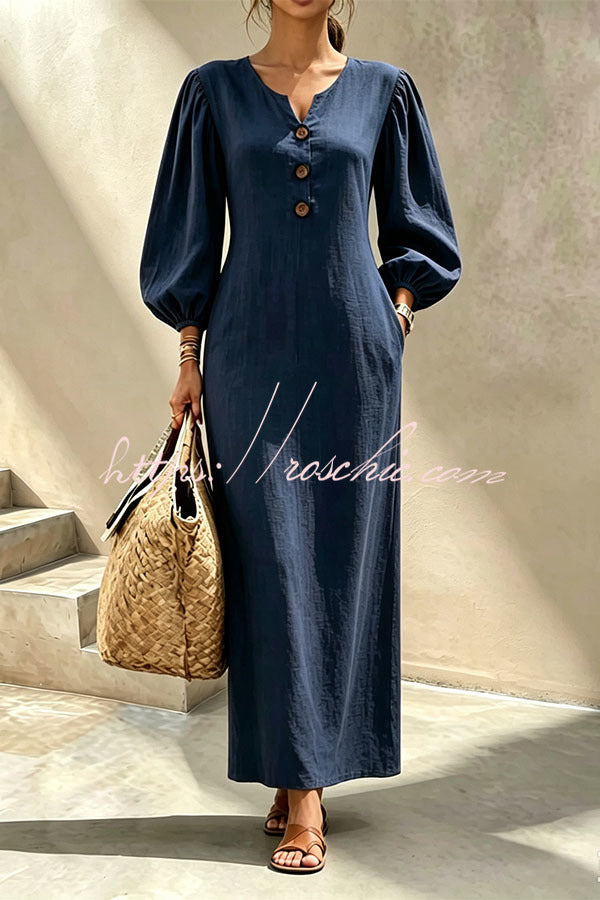 Navy blue v-neck maxi dress with button front and lantern sleeves
