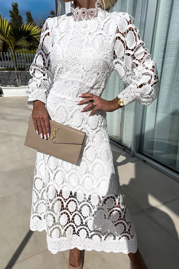 White lace midi dress with high neck and long puff sleeves, scalloped circular pattern.