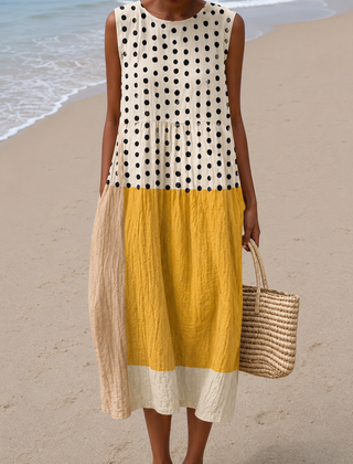 Sleeveless midi dress with black polka dots, mustard and cream colorblock tiers