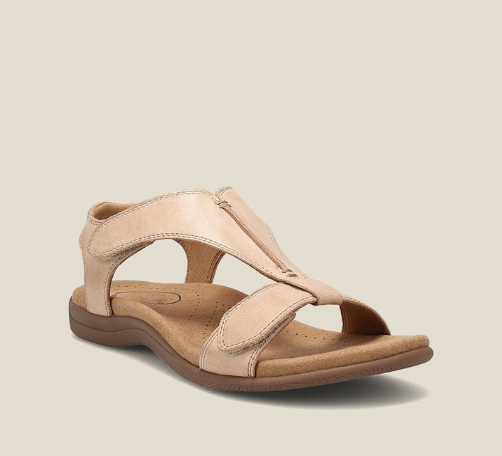 Beige orthopedic vegan leather sandal with open toe, wide strap, and cushioned sole.