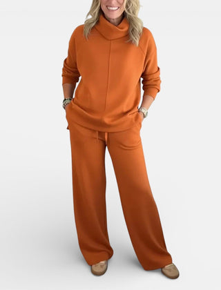 Orange hooded two-piece lounge set: long-sleeve top and wide-leg pants