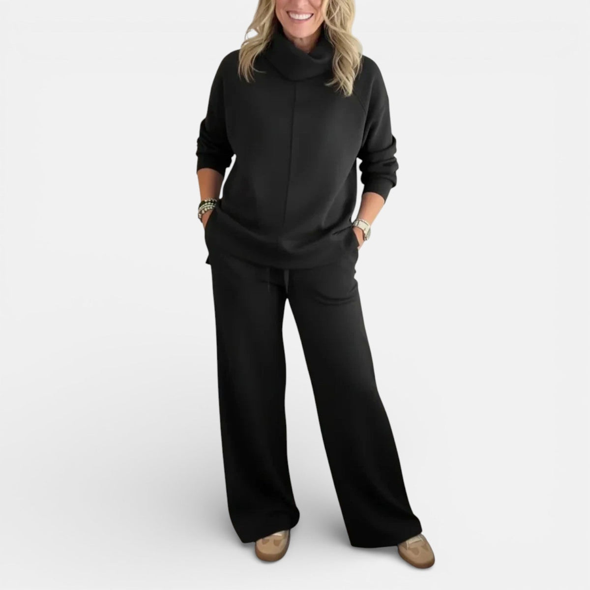 Black two-piece lounge set with hooded pullover and wide-leg pants