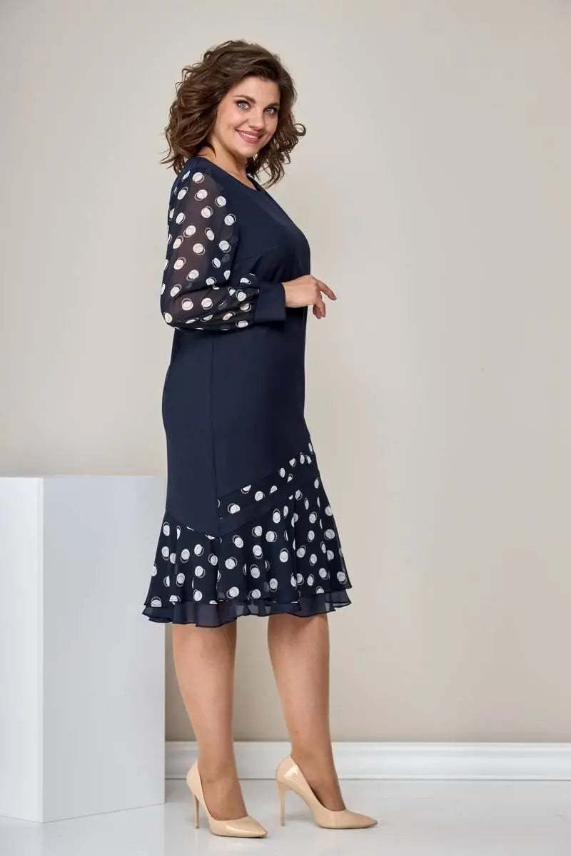 Navy chiffon dress with polka-dot sleeves and flared ruffle skirt