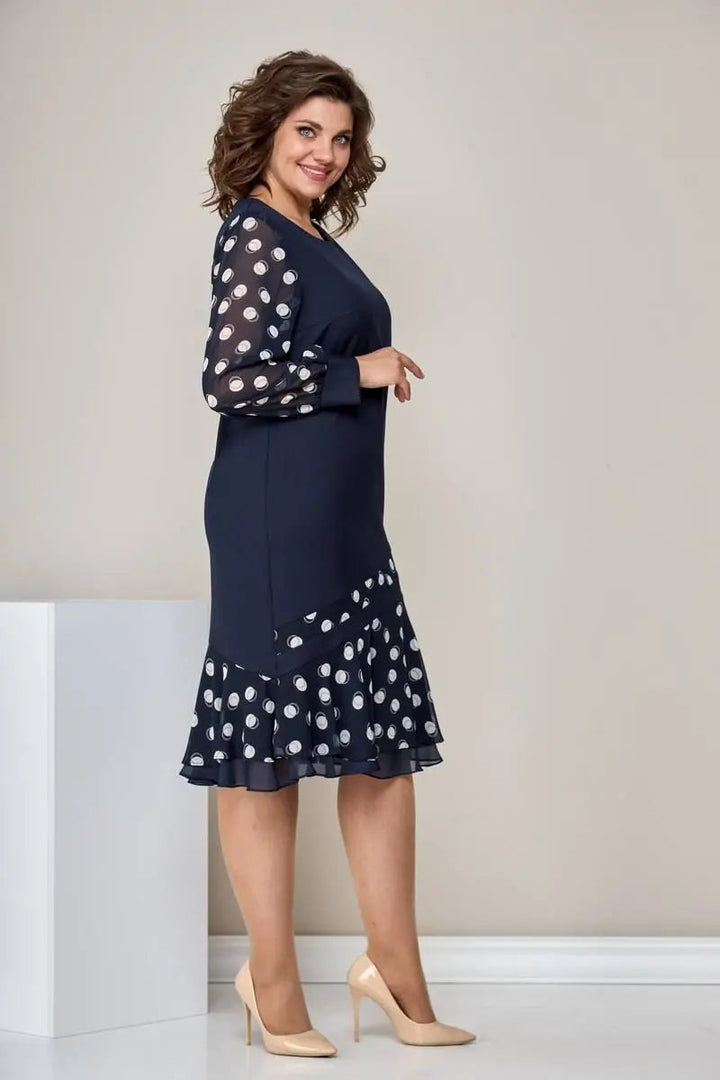 Navy chiffon dress with polka-dot sleeves and flared ruffle skirt