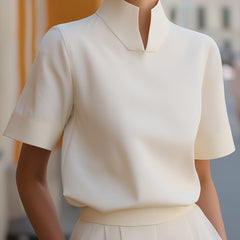 White structured blouse with stand collar and short sleeves, smooth minimalist front