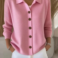 Light pink button-front knit cardigan with point collar and dark buttons, long sleeves