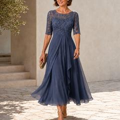 Blue lace midi dress with 3/4 sleeves, fitted bodice and layered chiffon skirt
