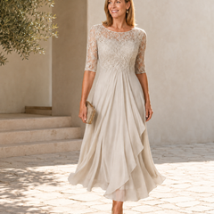 Cream lace midi dress with 3/4 sleeves, lace bodice and asymmetric layered skirt