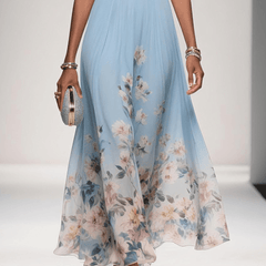 Light blue floral dress with draped waist and flowing midi skirt, lower-body view