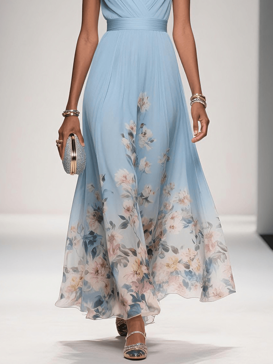 Light blue floral dress with draped waist and flowing midi skirt, lower-body view