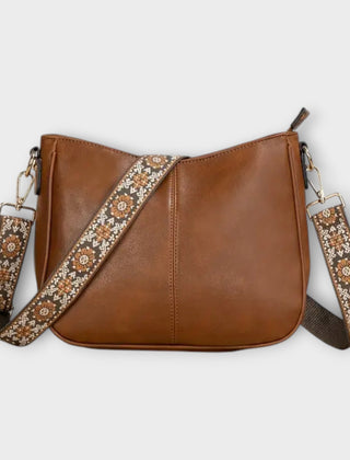 Brown vegan crossbody bag with patterned strap and chain shoulder straps