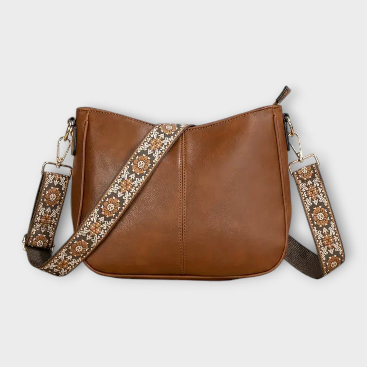 Brown vegan crossbody bag with patterned strap and chain shoulder straps