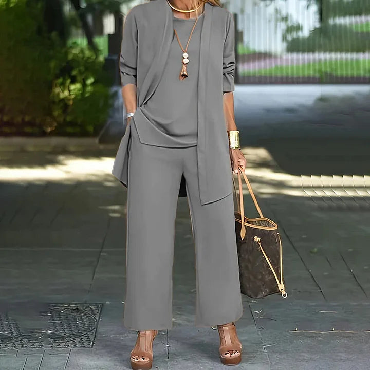 Grey 3-piece lounge set with long tunic, front pockets, and wide-leg pants