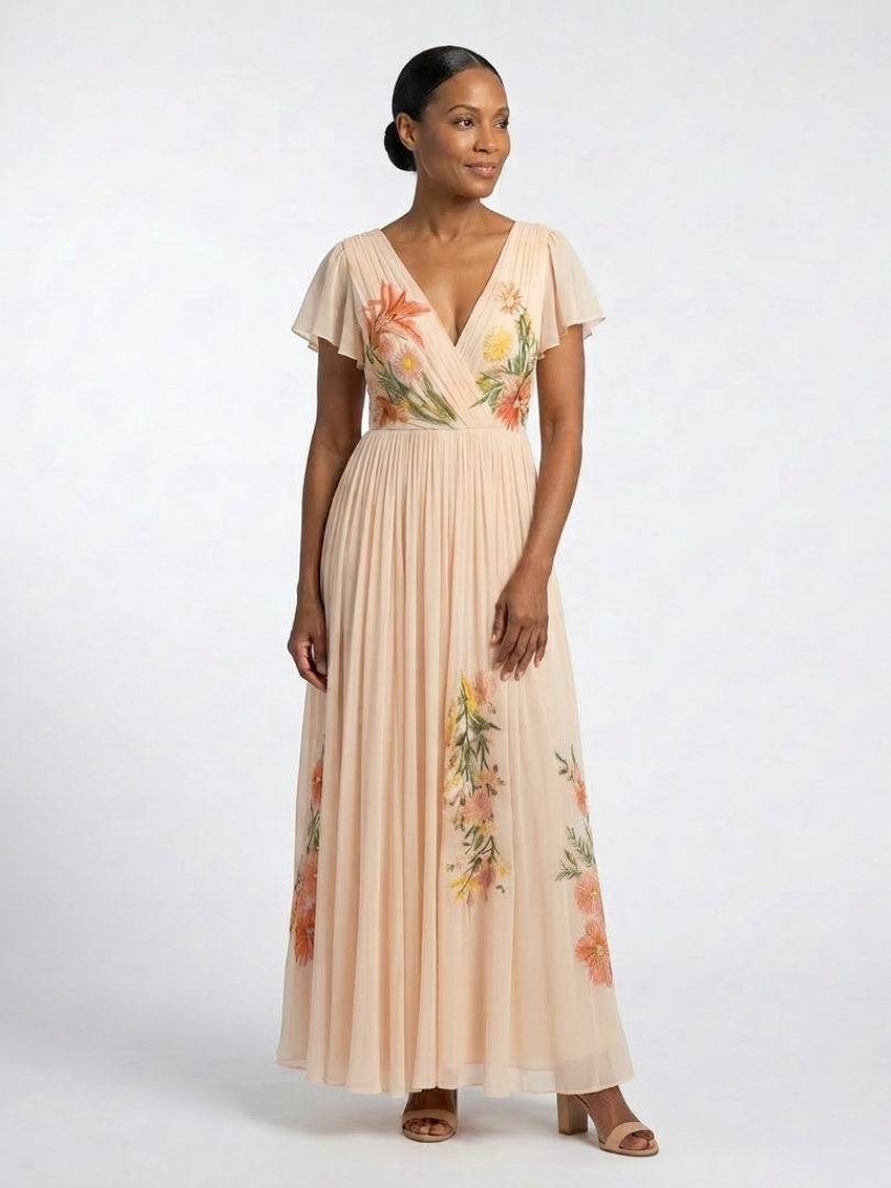 Peach V-neck pleated maxi dress with short sleeves and scattered floral embroidery