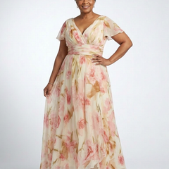 Pink floral maxi dress with V-neck front, short sleeves, and flowing tiered skirt
