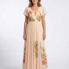 Peach maxi dress with V-neck, pleated waist, short sleeves, and floral embroidery