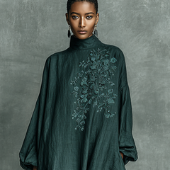 Teal maxi dress with high collar and detailed floral embroidery on chest