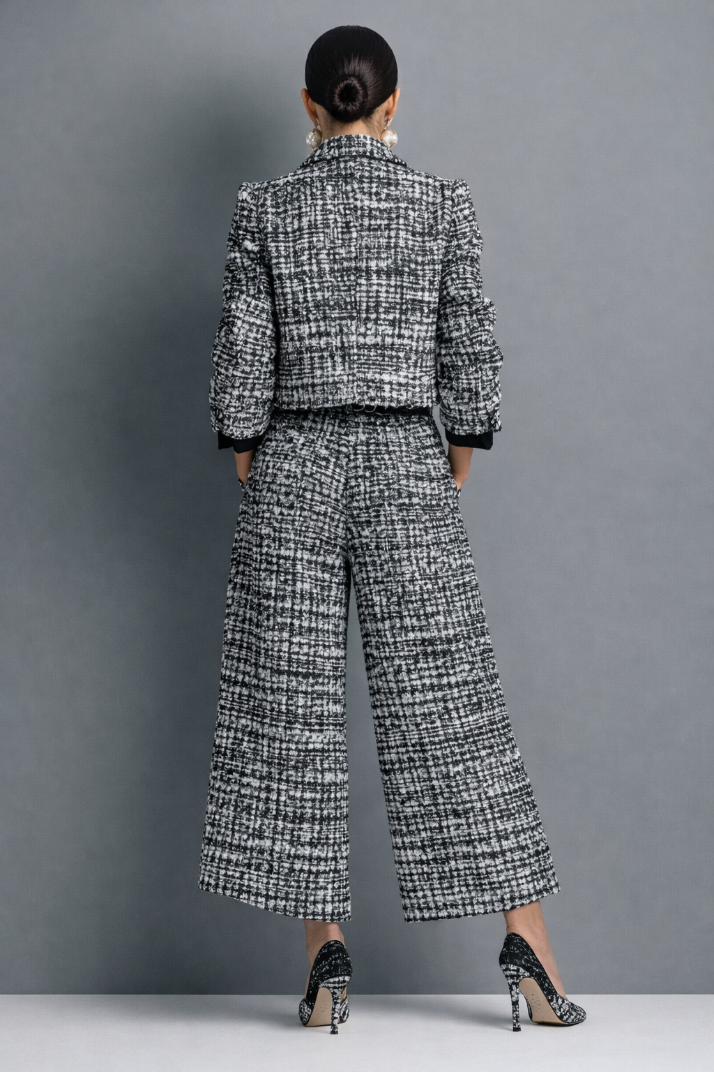 Black-and-white tweed blazer and wide-leg pants set, back view