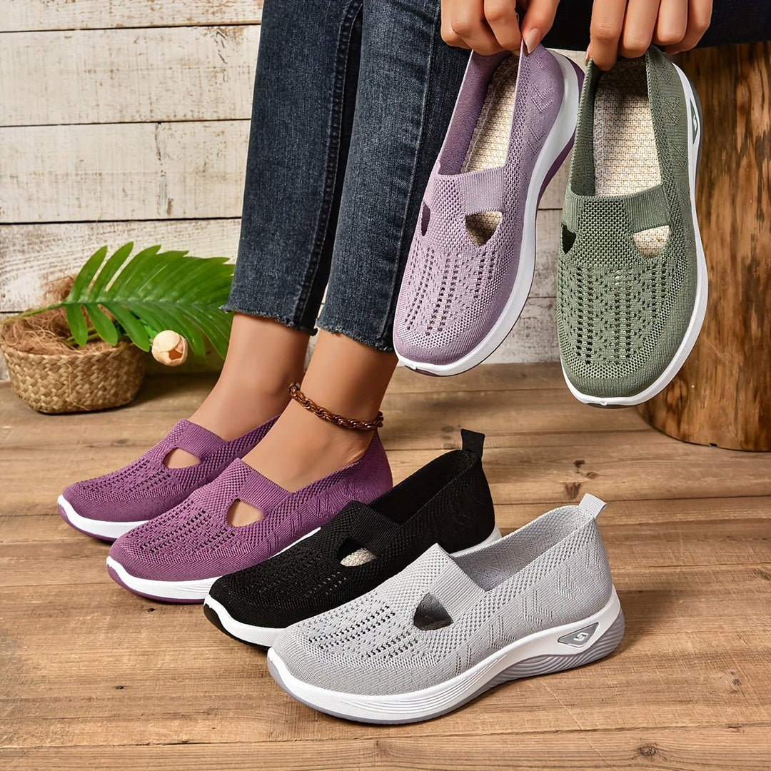 Knit orthopedic slip-on shoes in purple, green, black, and light grey, oval cutouts