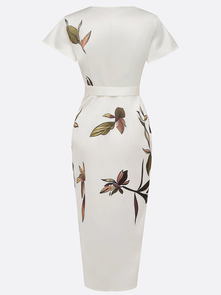 White back-view wrap dress with short sleeves and tie belt, bird-and-flower print