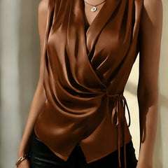 Brown satin sleeveless wrap top with deep V-neck and waist tie detail
