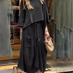 Sabrina set in black: loose tunic top with wide neckline and maxi skirt with distressed pockets