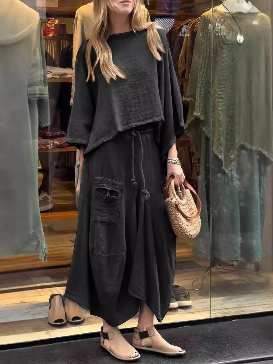 Sabrina set in black: loose tunic top with wide neckline and maxi skirt with distressed pockets