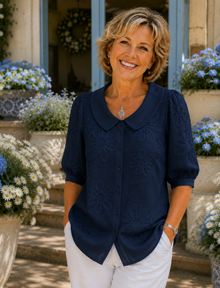 Navy floral embroidered blouse with round collar and short puff sleeves