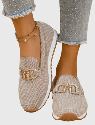 Beige slip-on loafer sneakers with gold buckle ornament and textured knit upper