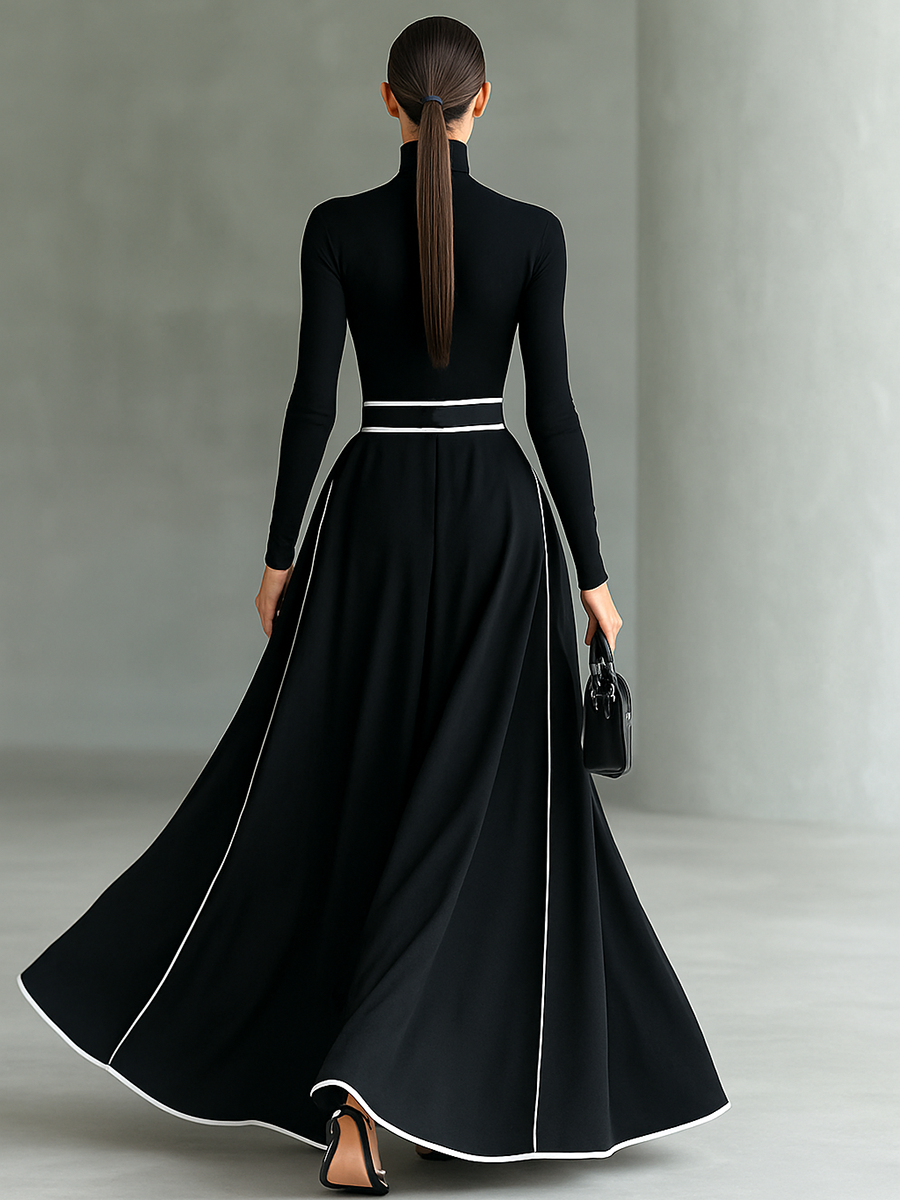 Black long-sleeve maxi dress, racerback back view, white belt, full circle skirt