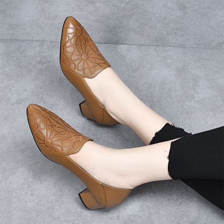 Tan brown embroidered leather pumps with pointed toe and textured floral pattern