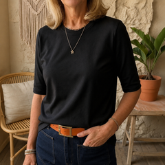 Black crewneck comfort tee with 3/4 sleeves and relaxed draped fit