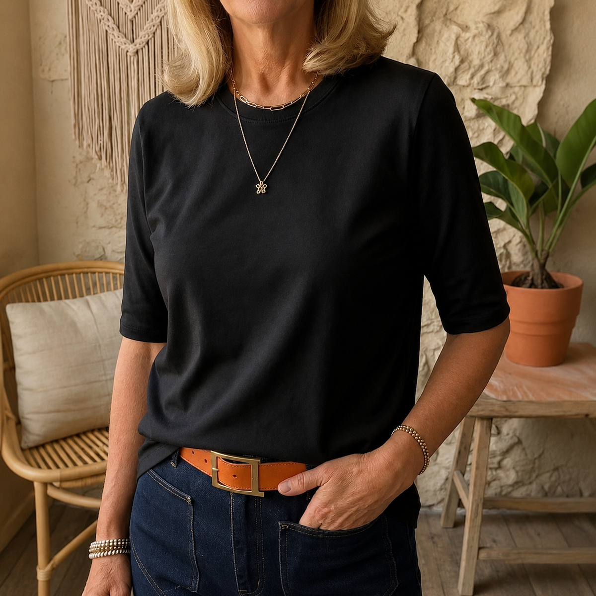 Black crewneck comfort tee with 3/4 sleeves and relaxed draped fit